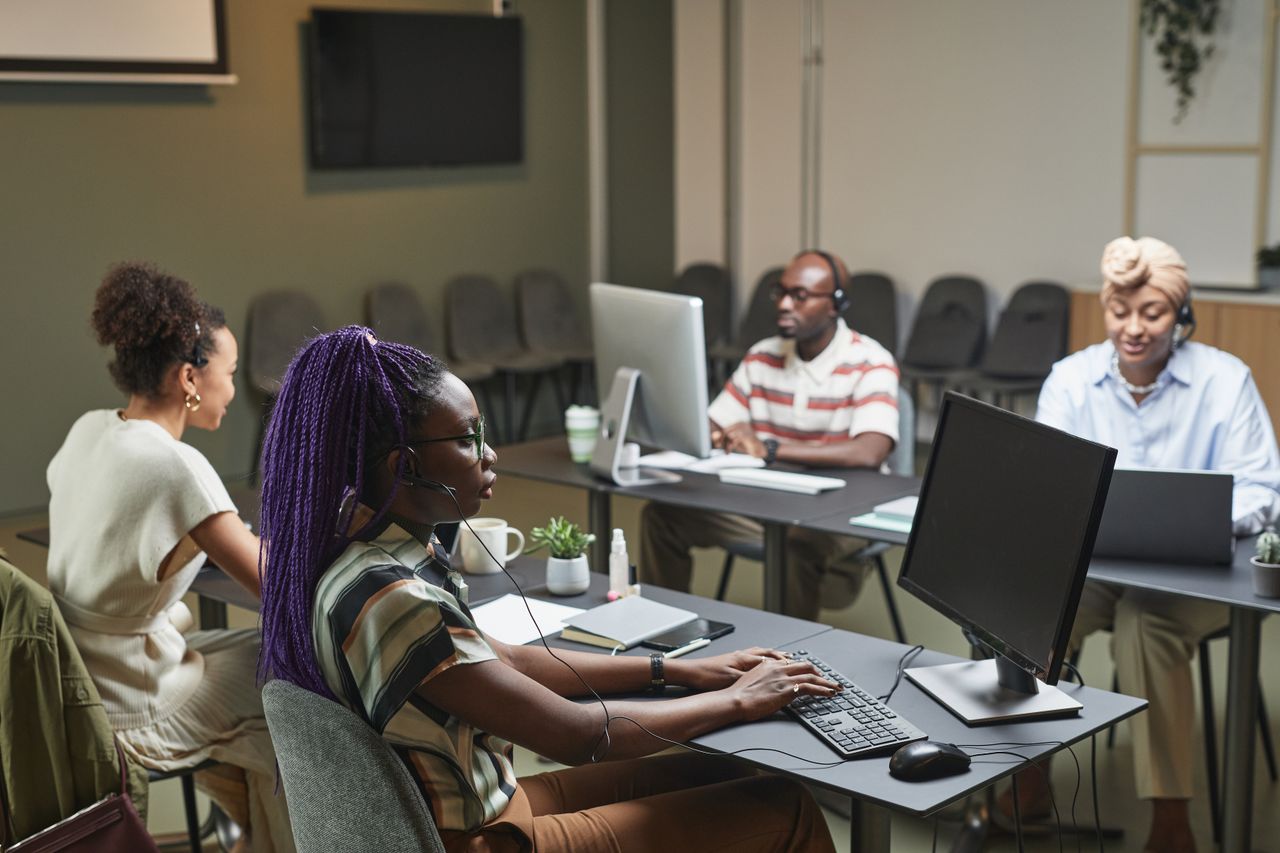 The Art of Drawing Readers In: Your attractive post title goes here A diverse group of professionals working collaboratively in a modern office setting.